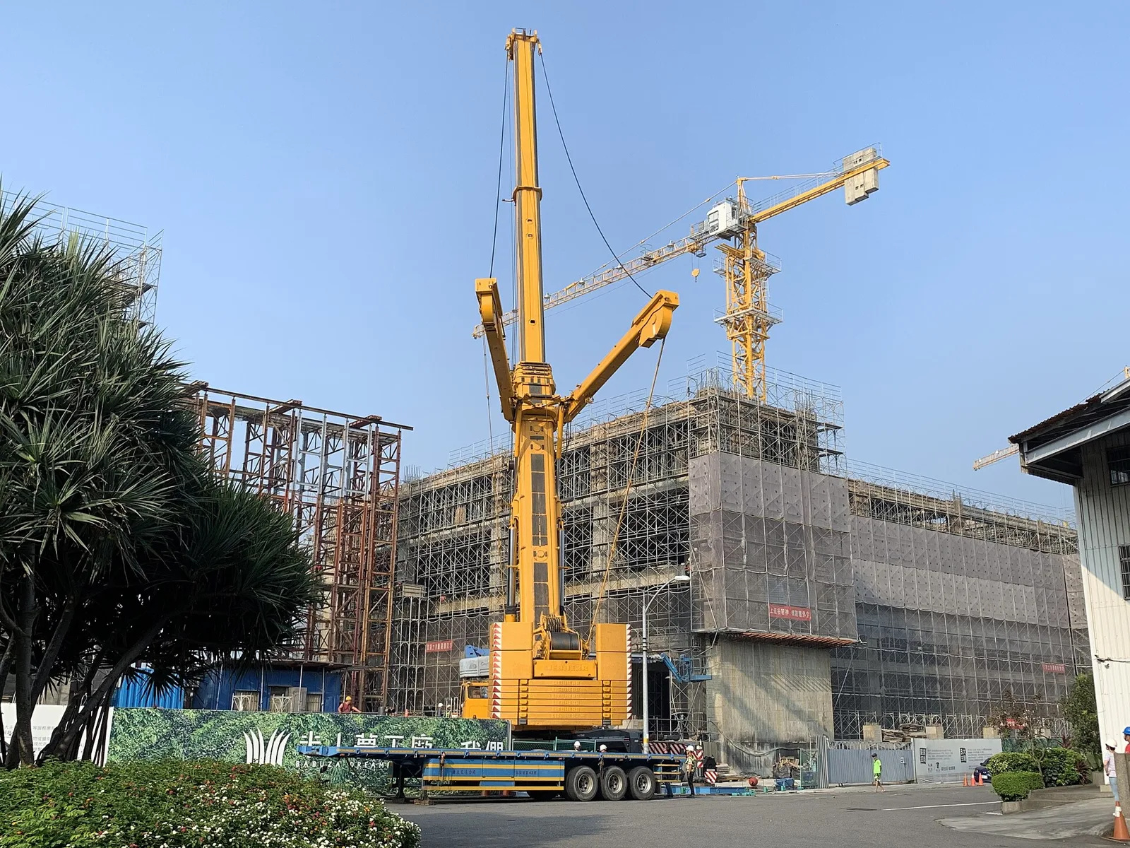PCE Cranes crawler crane working at dusk on an Egyptian construction site